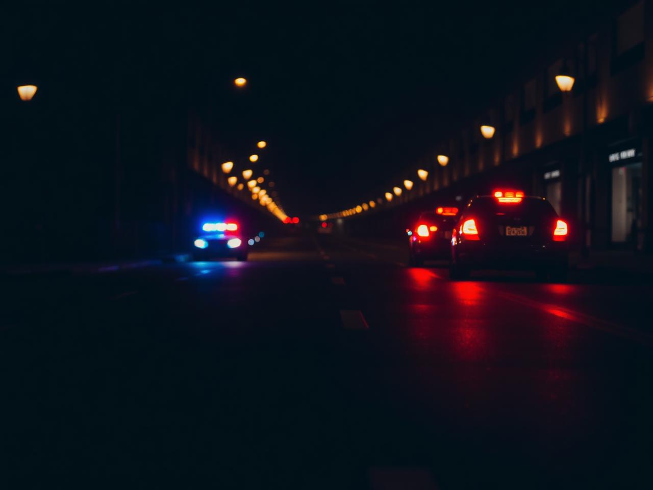 San Diego DUI defense attorney: patrol car with emergency lights during a nighttime DUI stop in Southern California